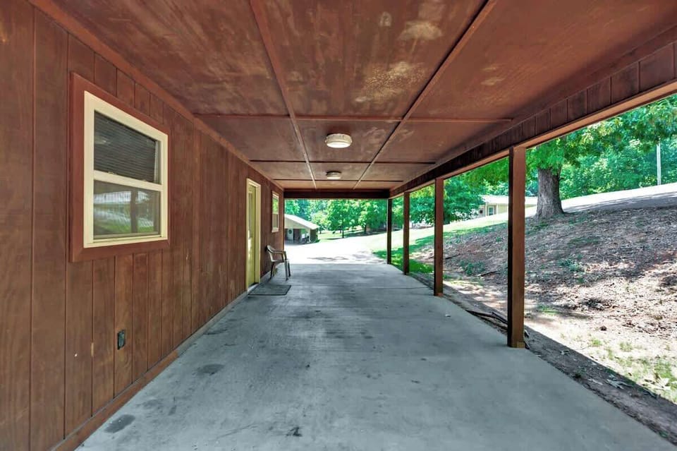 Enjoy parking your boat under this porch where you'll have access to an electrical outlet, lighting, and cover from the weather!
