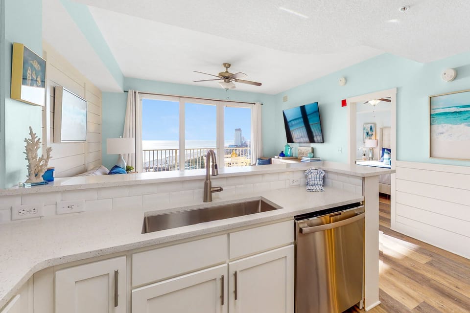 Beautiful kitchen with stainless steel appliances and large sink.
