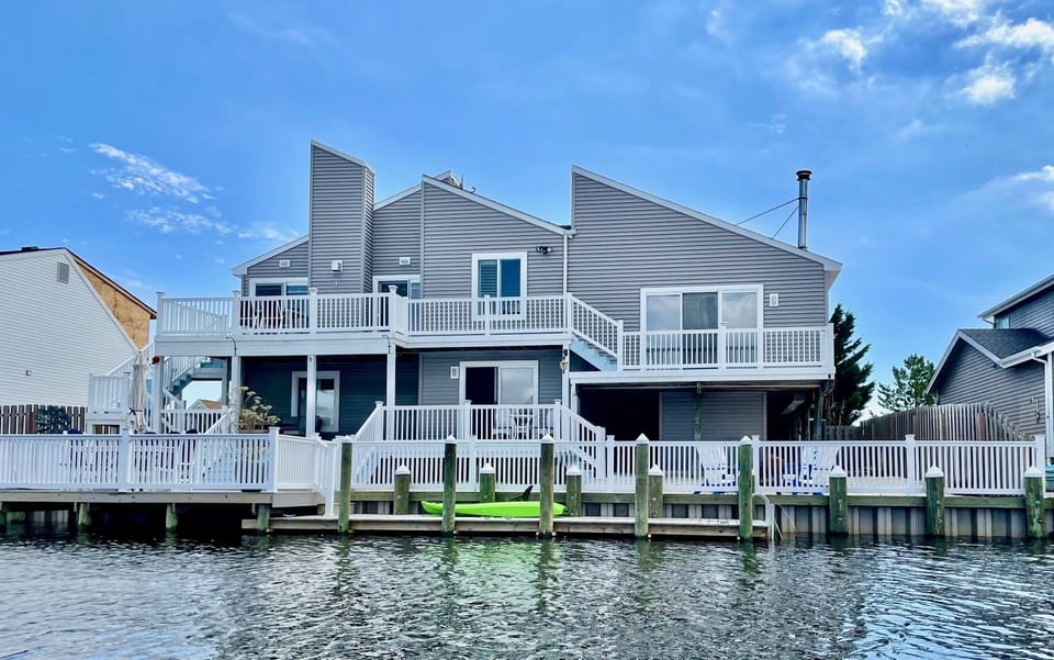 Outdoor fun in a fully fenced backyard, 72 ft waterfront & three-level deck.