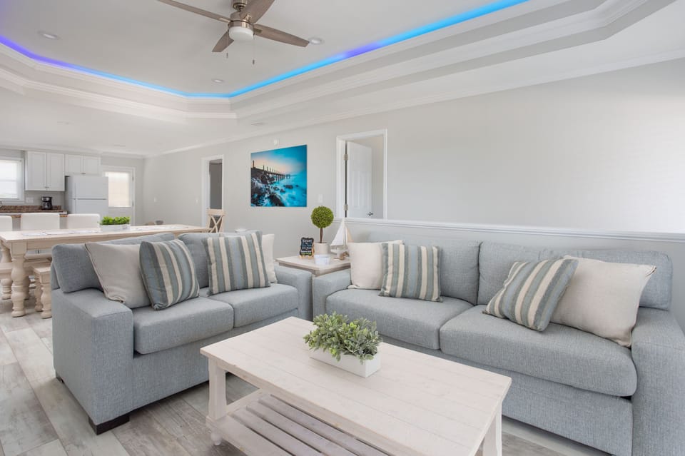 Upstairs living room with guest controlled LED tray lighting on the ceiling.