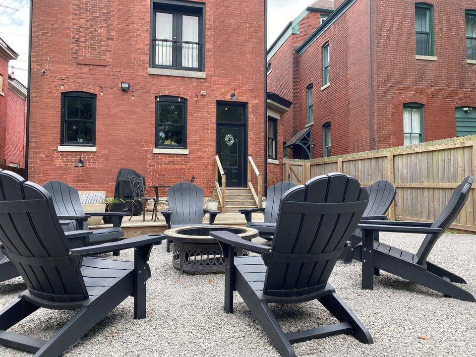 Huge rear patio with fire pit and market lights
