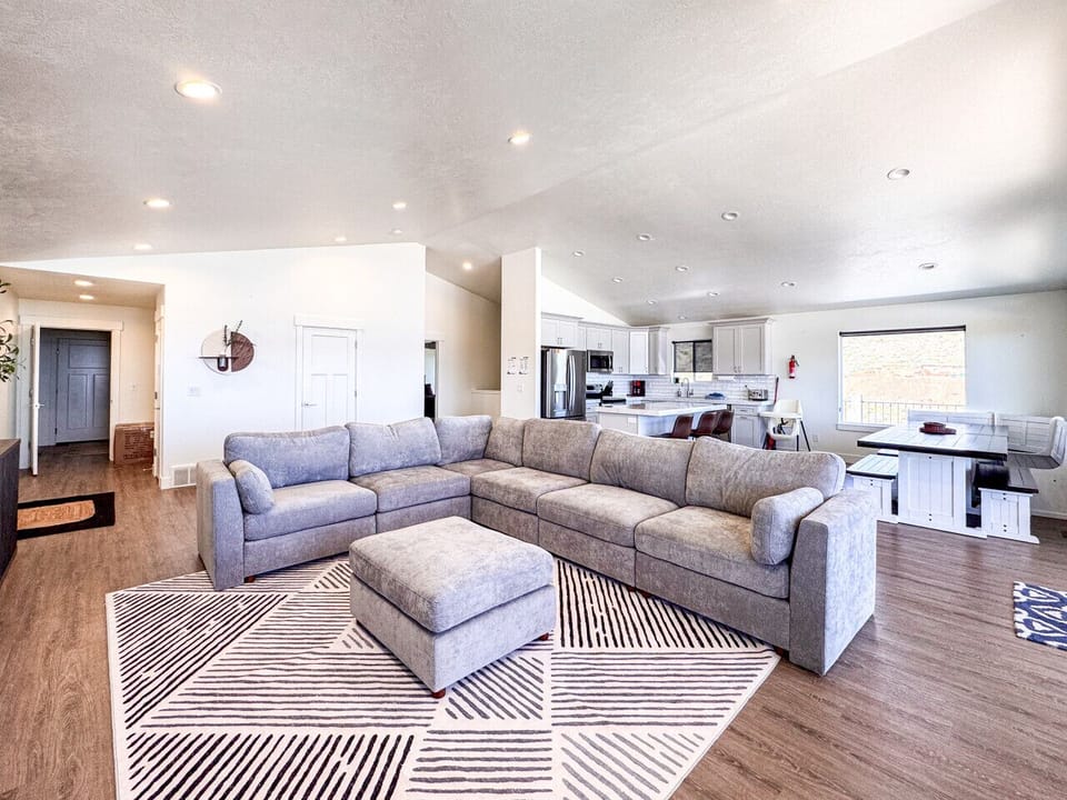 Spacious open-concept living with comfy seating, and a modern kitchen for entertaining.