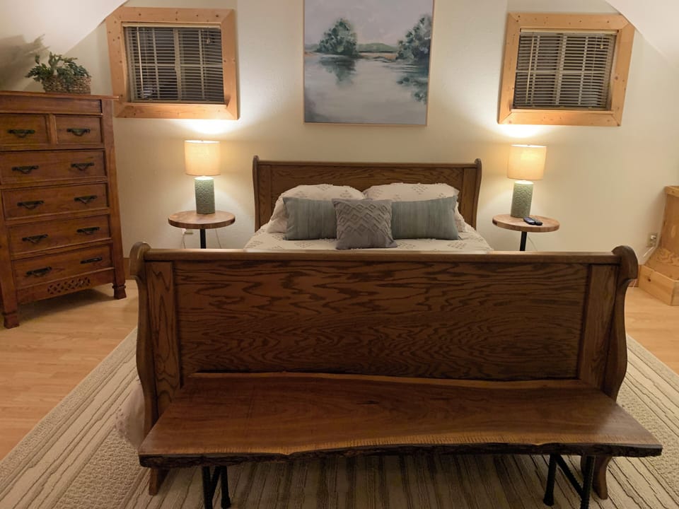 This is the upstairs master bedroom with a queen-sized bed.