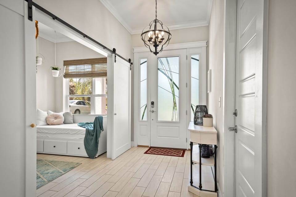Main entrance. The room with the daybed closes with barn doors.