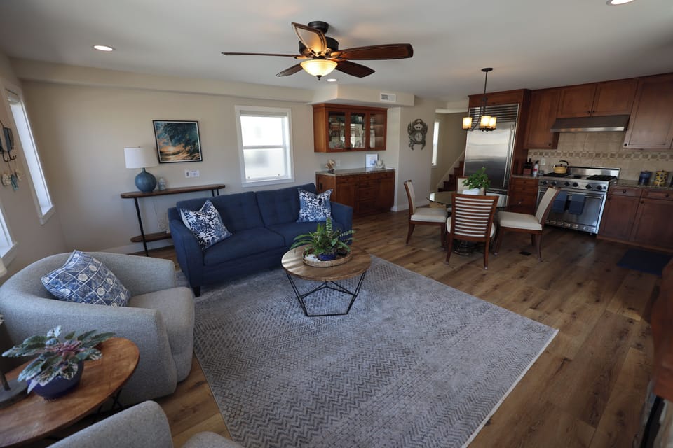 Comfortable open concept living room and fully stocked kitchen  