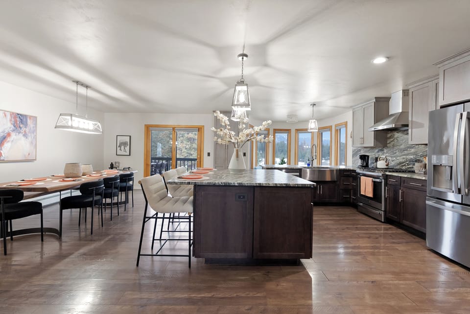 Fully equipped kitchen appliances, cookware, and prep space.
