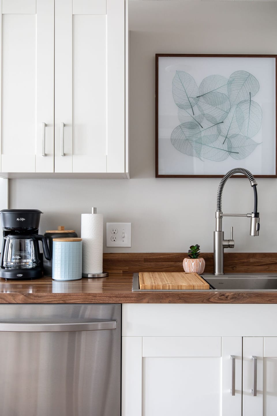 Coffee station w/ drip maker, mugs & counter space to start your morning right.