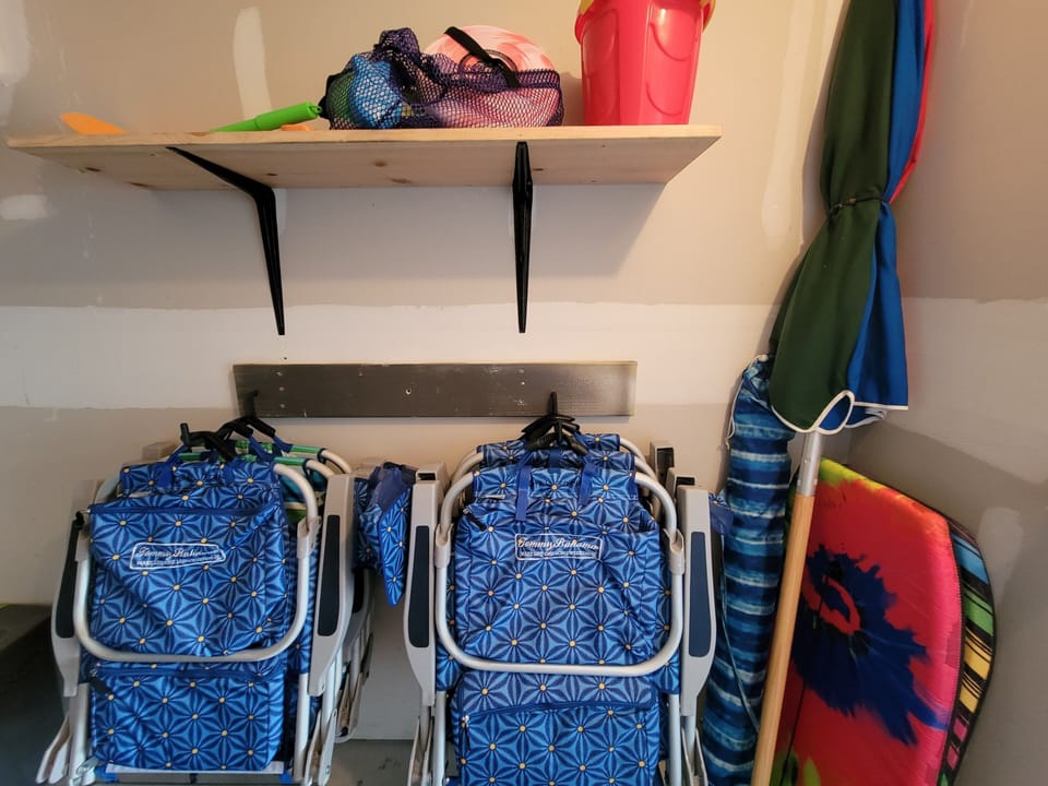 Beach Closet has chairs, umbrellas, boogie boards and some toys