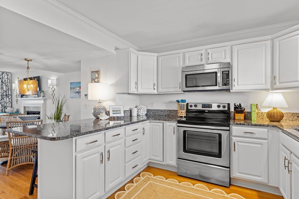 Step into luxury in our coastal home's elegant kitchen where dreams come true