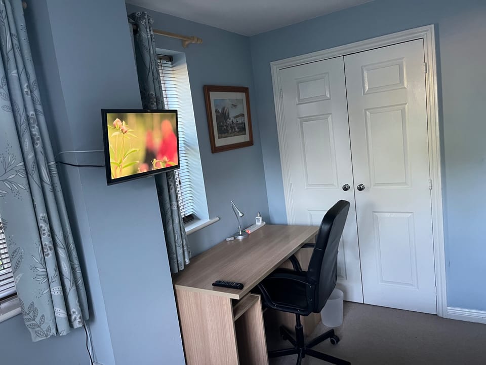 Wall mounted TV in Bedroom.