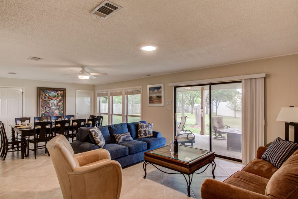 Living room and dining area with tile flooring throughout