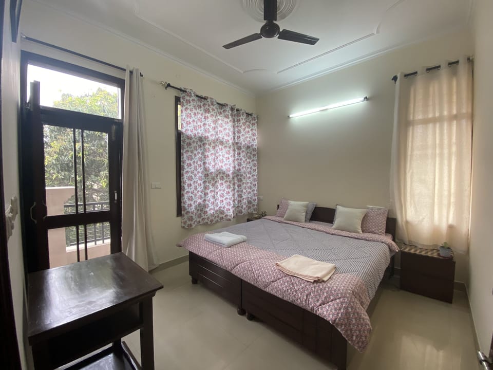 Tropical room with study desk & an access to the front terrace.