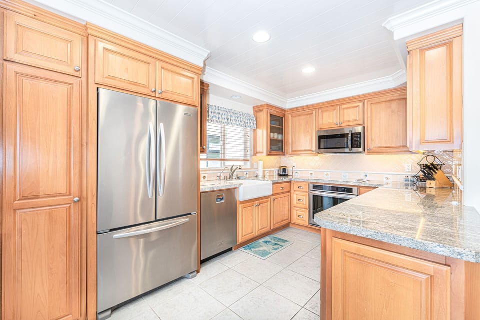 The kitchen comes stocked with dishes, utensils, cookware, bakeware, and large/small appliances.
                