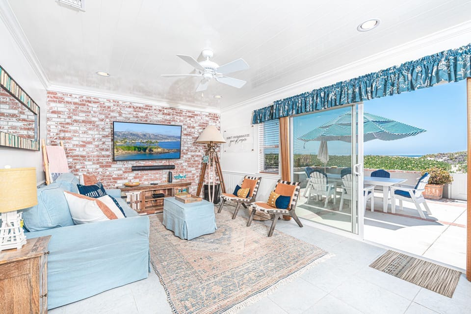 Large sliding doors offer fabulous beach views from every vantage point in the front living area.
                