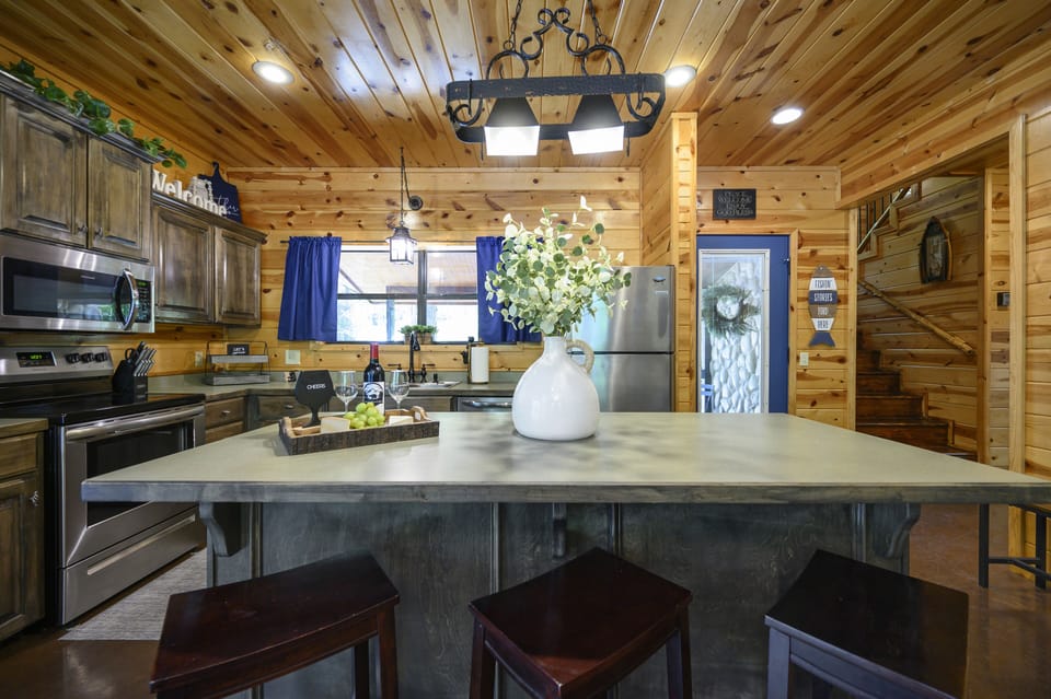 Kitchen with a view of the front door and steps up to loft and 2nd master bedrm