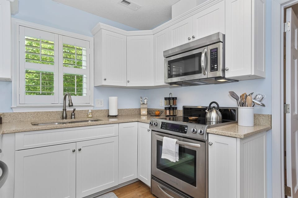 The kitchen is equipped with high quality stainless steel Kitchen Aid appliances.