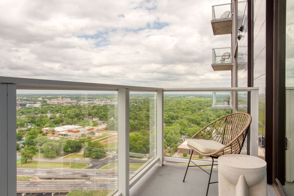 Balcony with seating and expansive views.