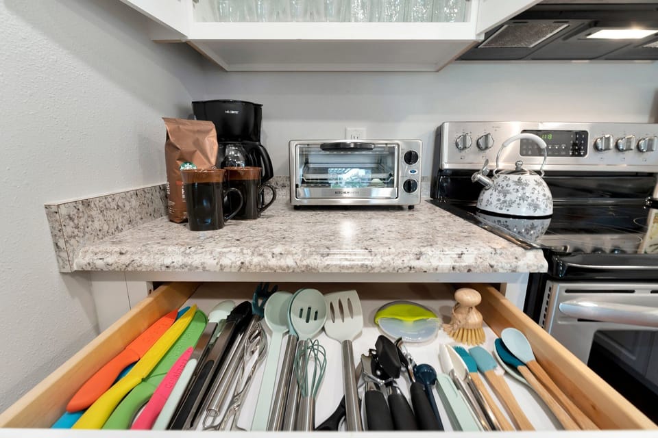 Fully supplied cooking utensils... coffee pot, tea kettle and toaster oven