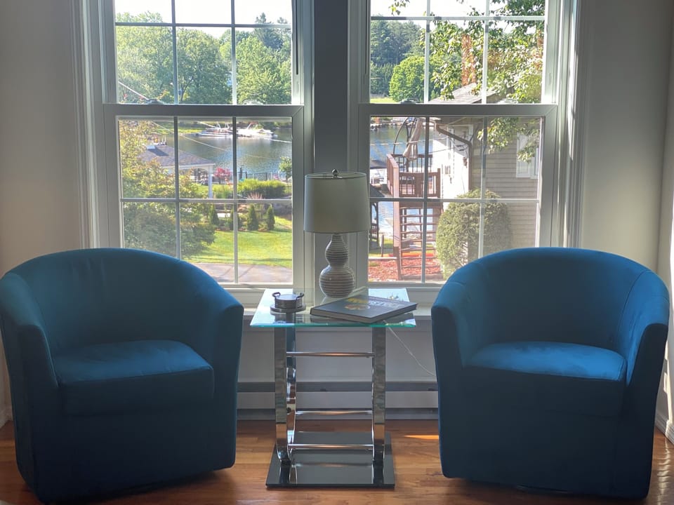 Stunning lake view from your cozy, bright living room.