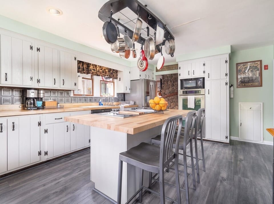 Gather around our kitchen island with seats, the perfect centerpiece where family and friends can come together, share stories, and create lasting memories.