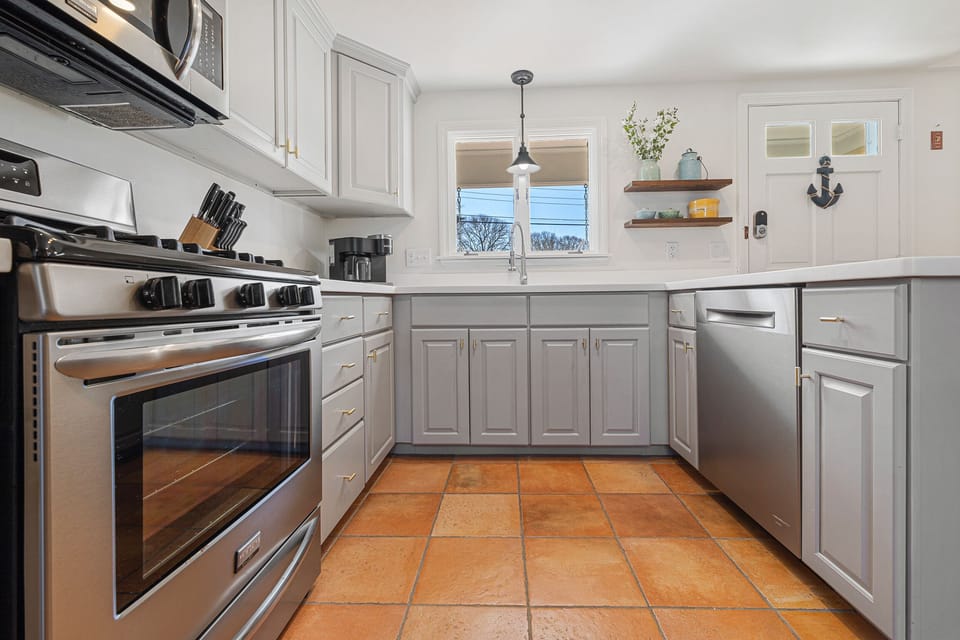 Fully equipped kitchen with modern appliances.