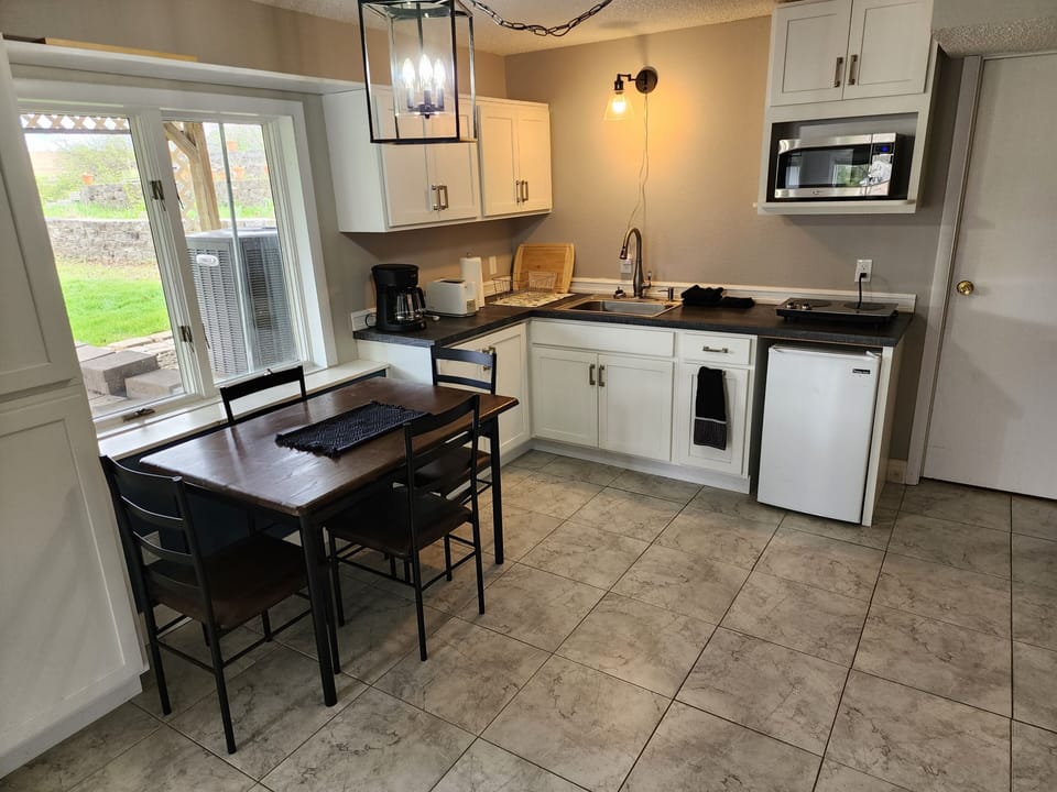 Kitchen/dining room. The table easily slides out when eating.