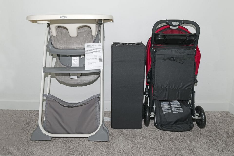 Brand new high chair, a baby crib, and a stroller