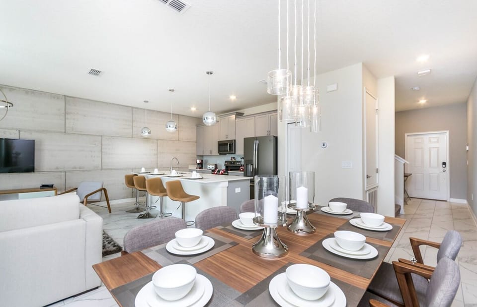 Gorgeous interiors and light fixtures with beautiful industrial-look wall finish