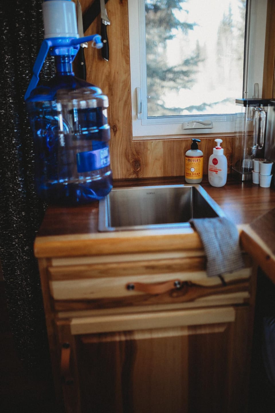 Conveniently located sink, with ample storage beneath and a water dispenser for your comfort. Clean, functional, and ready for any culinary task during your stay.