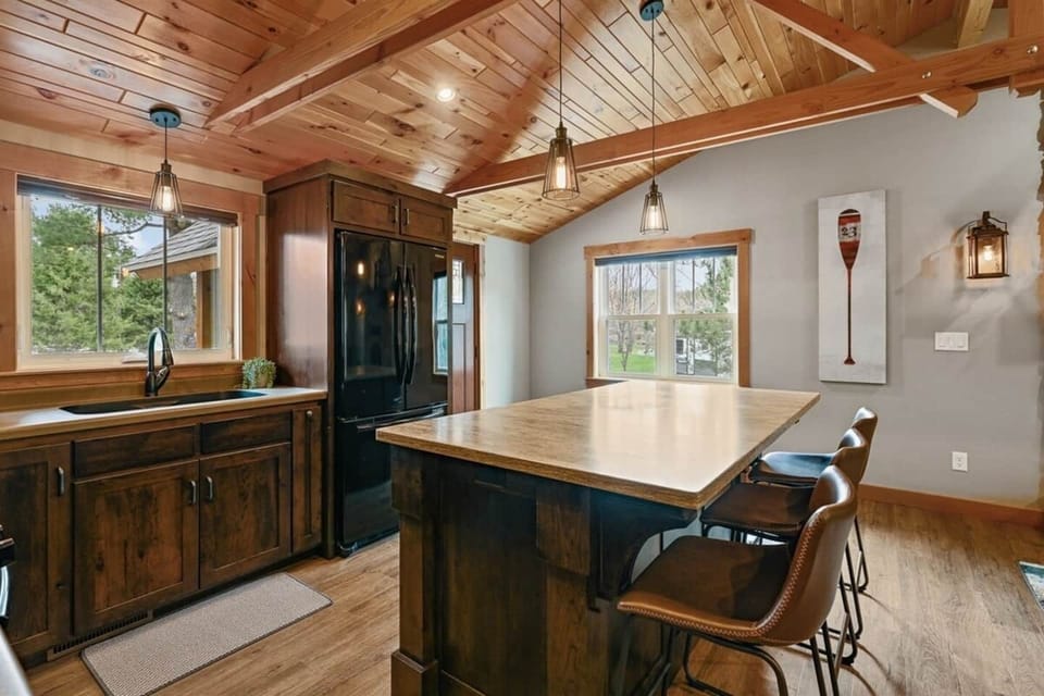 Thoughtfully designed kitchen with rich wood finishes.