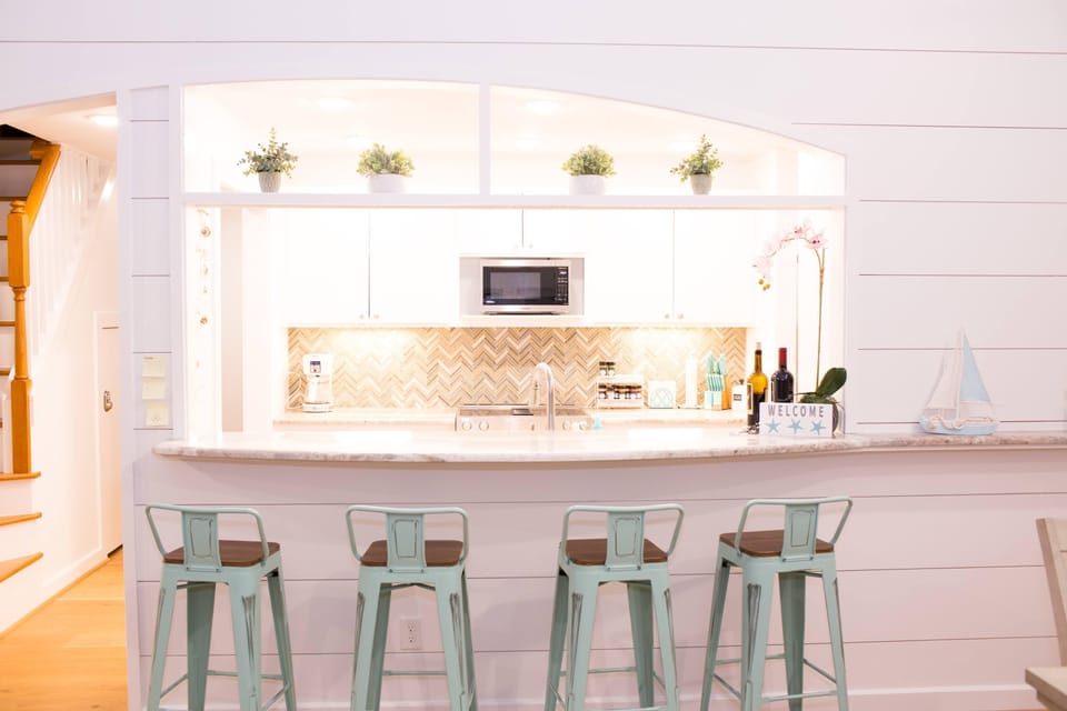 Bar stools provide additional seatings, if needed.