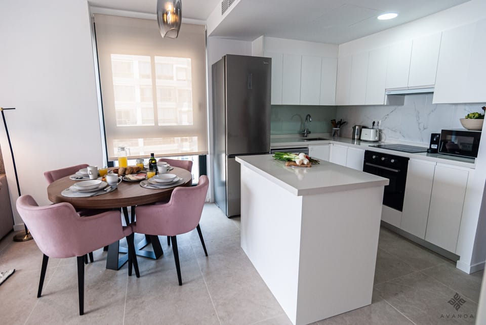 Modern open-plan kitchen with lots of light