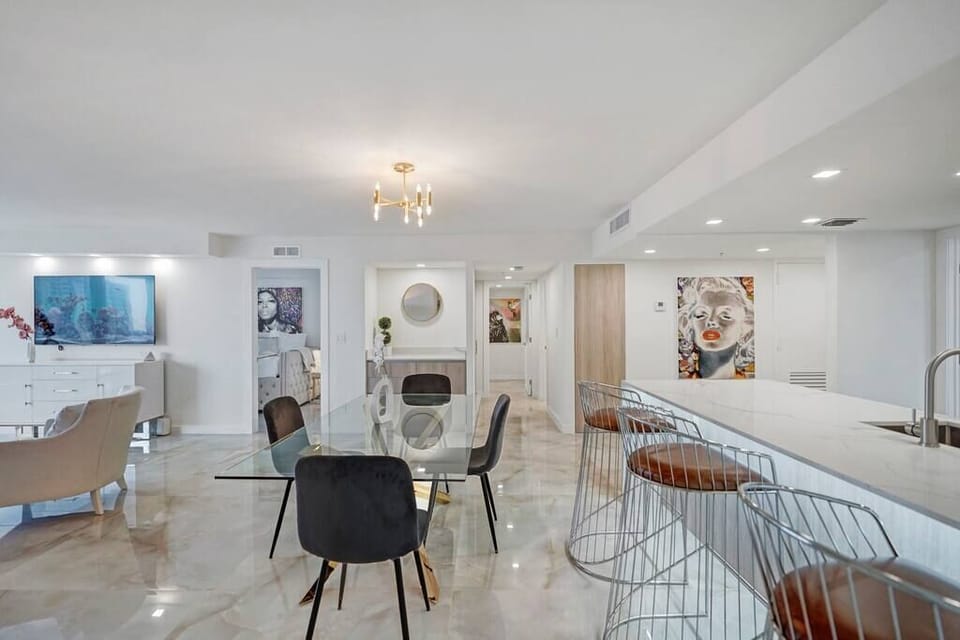 Dining area, fully equipped kitchen to right and living room with Roku streaming tv to left