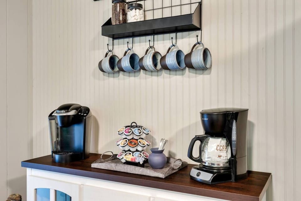 Kickstart your day at our Pigeon Forge home's premium coffee station. Keurig and drip options with a variety of brews. Steps away from downtown attractions! #PigeonForgeStay #DowntownConvenience