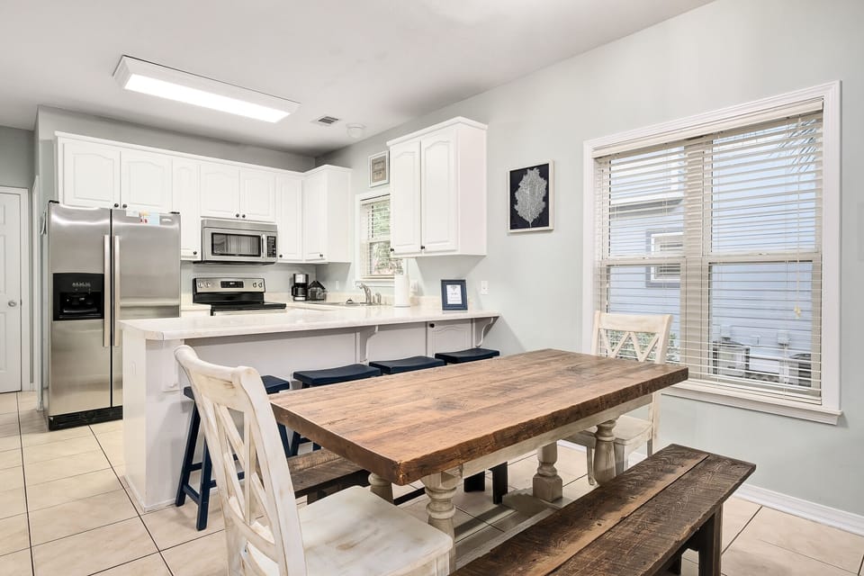 Dining area and kitchen with updated appliances 