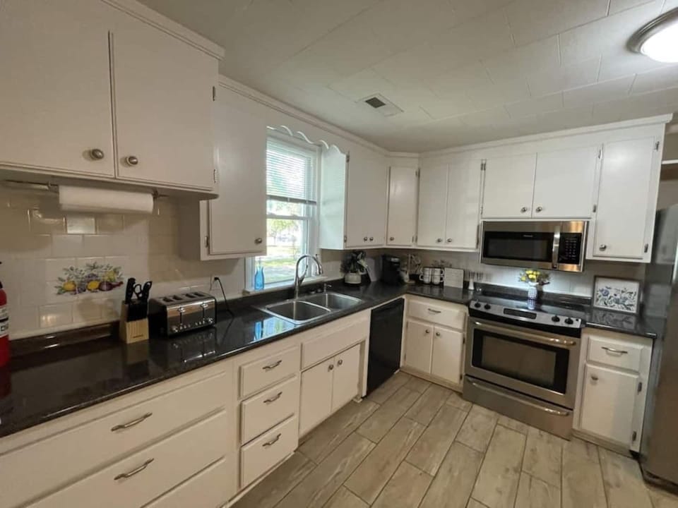 Kitchen has pots and pans to cook meals