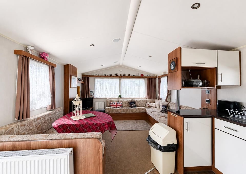 Prepare your favourite holiday meals while being part of the conversation in this convenient open plan caravan kitchen.
