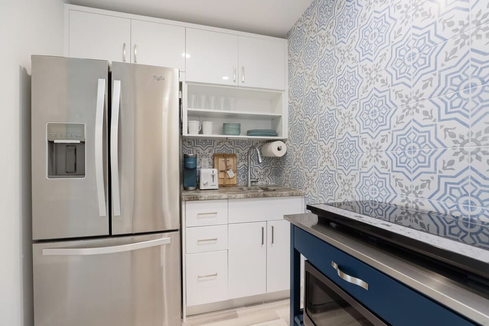 Full refrigerator and freezer, microwave and induction cooktop