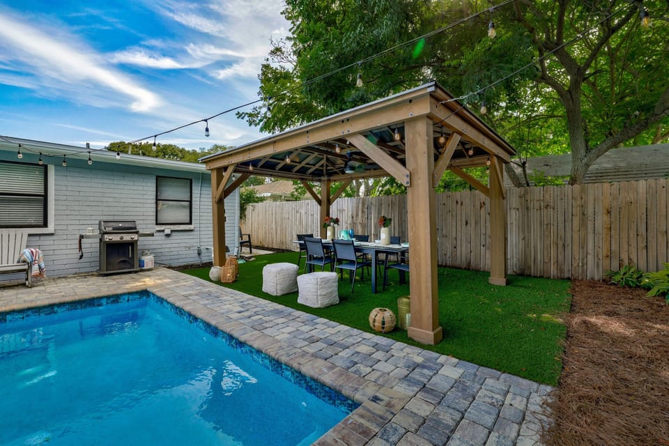 Shaded dining area next to the pool for meals or working in the salt air