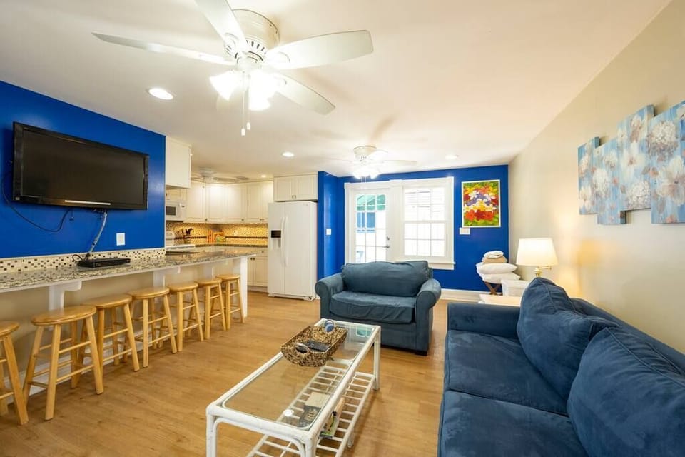 Bar seating, access to the kitchen, and streaming HULU make this a spot to relax. 