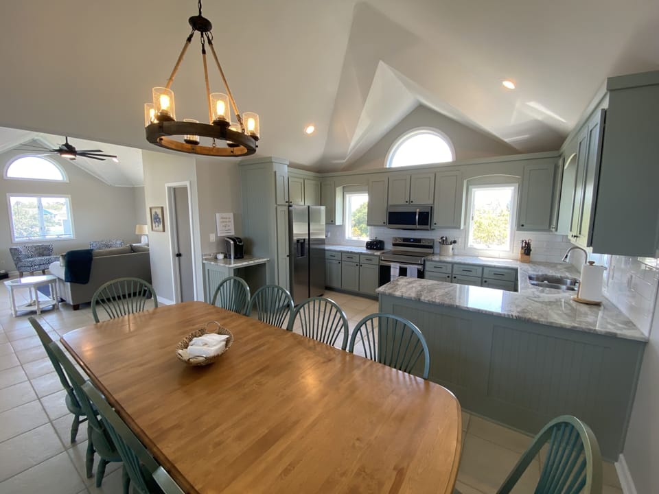 Kitchen with living room in background