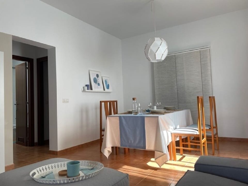 living room, with dining table, sofa, TV, furniture