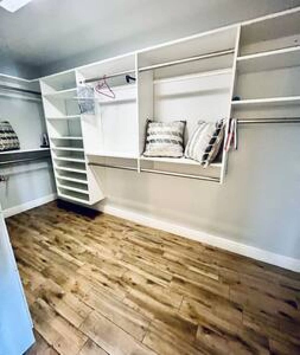 Master Closet: Massive Walk-in Space, Multiple Storage Compartments, Clothing Hangers