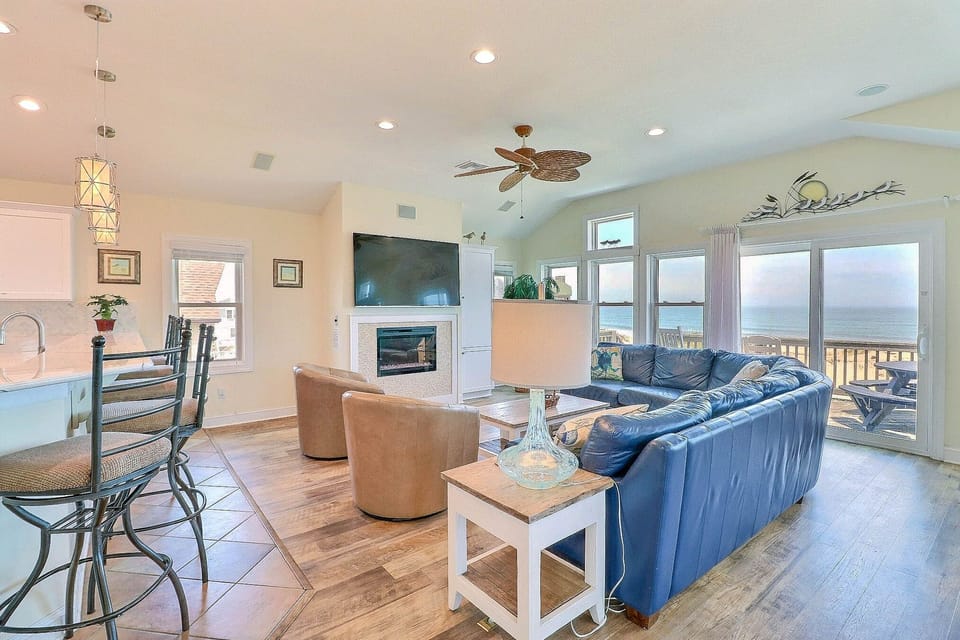 Gather together in the thoughtfully decorated living area with plenty of seating for everyone and beautiful ocean views.