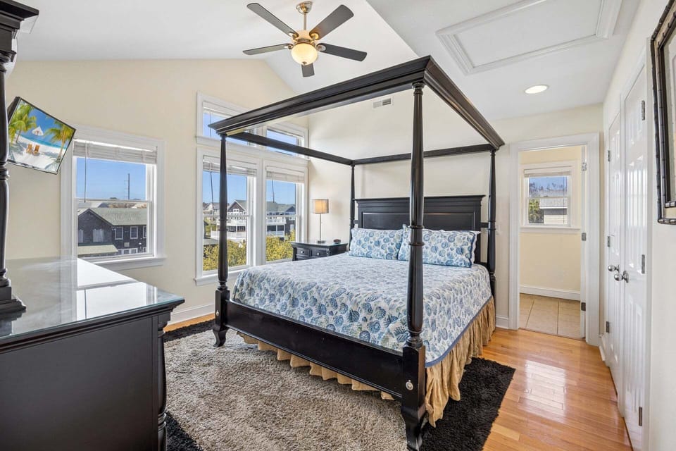 Retreat to the gorgeous Master Bedroom with high ceilings when you're ready to relax for another day of exploring the Outer Banks.