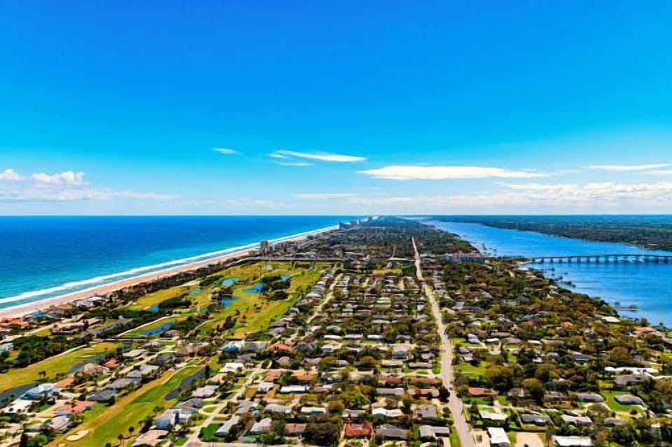 Soar above miles of coastline and sparkling blue water.