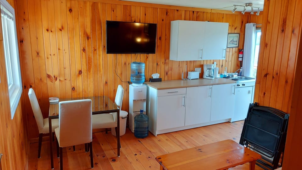 Living Room/Dining and Kitchen area with TV