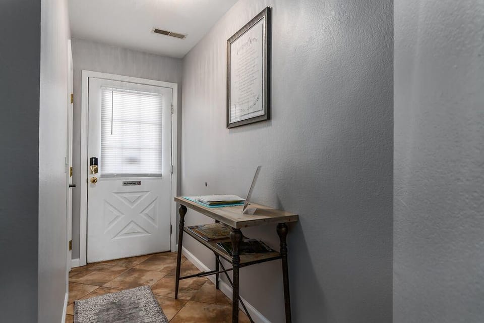 Welcoming foyer with new tile floor and welcome book. 