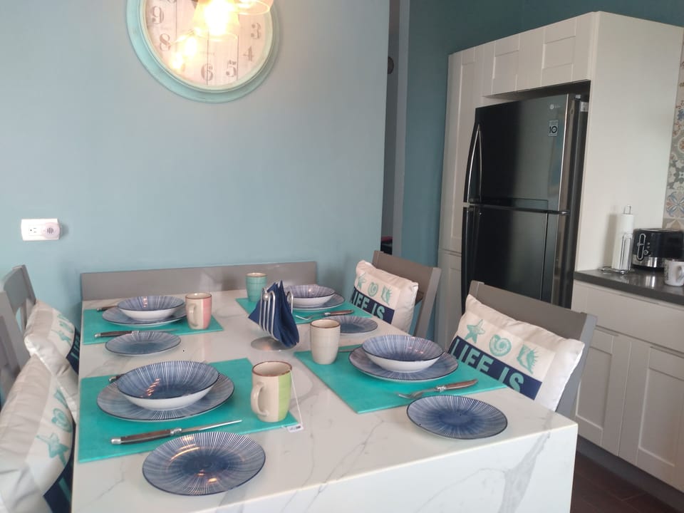 Built in table for 4 with QUARTZ counter top and waterfall side