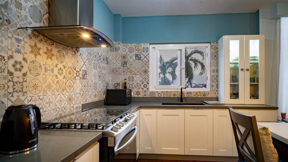 Beautiful Top of the line kitchen with stainless steel appliances.